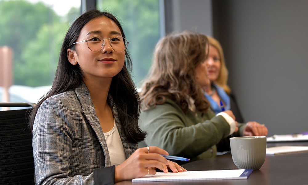 A female Openzonefy employee in a meeting